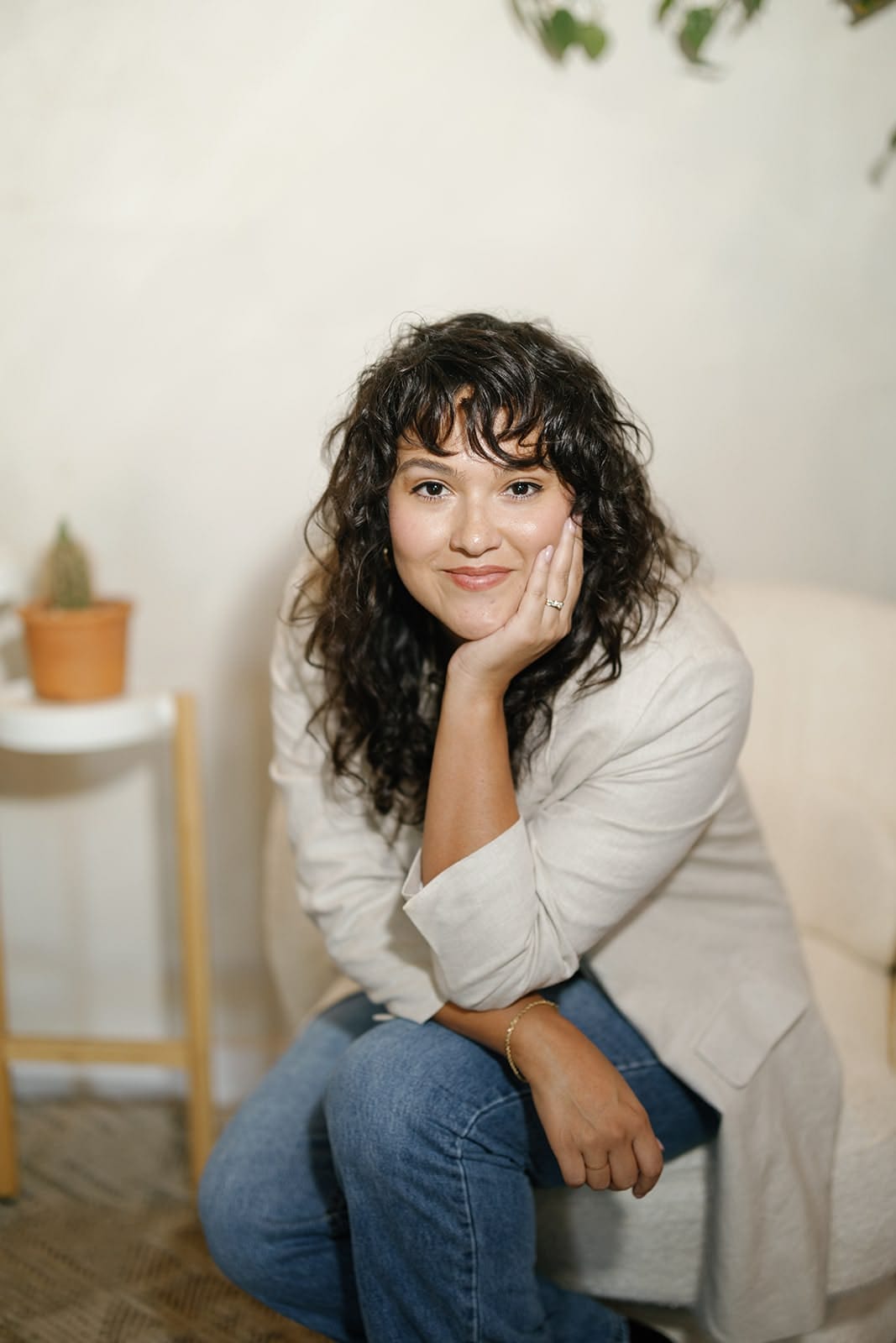Heidi Alaniz Critz sitting in a chair looking at the camera